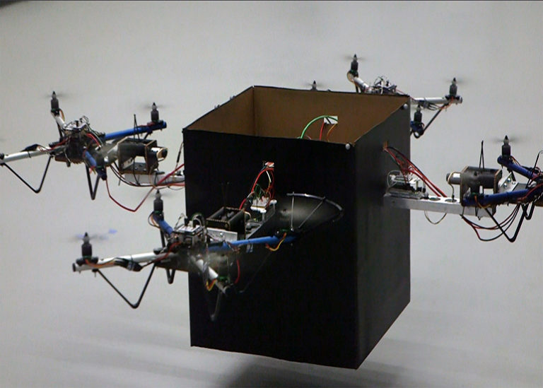 Control system helps several drones team up to deliver heavy packages