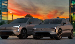 Volvo EX30 and Volvo EX90 together against the backdrop of a modern office building