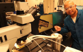 UC Irvine postdoctoral scholar Dmitri Cordova examines a sample of the crystal used by Professor Maxx Arguilla's lab to develop innovative nano-scale thermometers. (Photo credit: Lucas Van Wyk Joel)