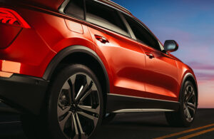 red modern car, automobile on a background of a street, close up of a side, illustration and 3d render.