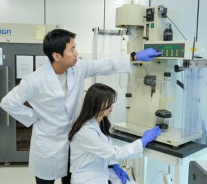 Researcher Insung Hwang manufacturing dry electrodes using calendering