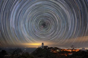 Long-exposure star trails over the Mayall Telescope, where DESI is installed.