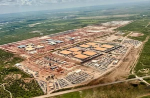Aerial view of OpenAI's Stargate I data center under construction in Abilene, Texas, where the company is already running early AI training workloads. 