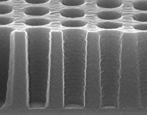 Cross-section SEM image showing 300nm 1:1 contact holes patterned in 1.38µm film thickness on 900Å BARC (Image: Qnity)