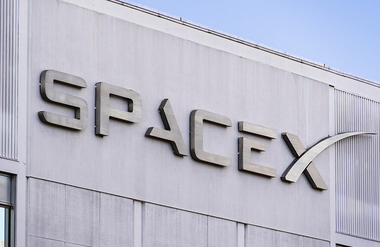 Dec 8, 2019 Hawthorne / Los Angeles / CA / USA - close up of SpaceX (Space Exploration Technologies Corp.) sign at their headquarters; SpaceX is a private American aerospace manufacturer