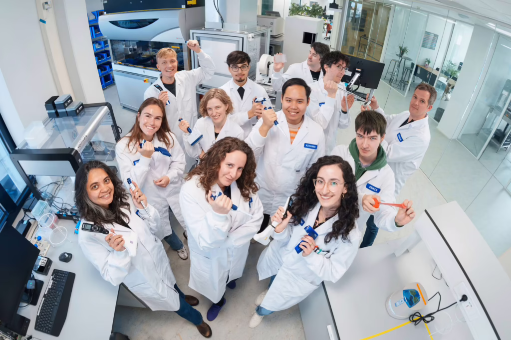 Scientists at Cradle's Amsterdam lab. The AI biotech company used UniteLabs to automate protein QC workflows, cutting a 10-step manual process to three clicks. (Credit: UniteLabs/Cradle)