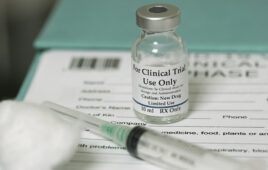 Clinical trial medicine, for the covid-19 coronavirus, on clipboard