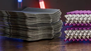 A composite view of a synthesized MXene, combining a model based on scanning electron microscopy at left with a visualization of the underlying crystal lattice. The triphasic etching method produces the uniform halogen surface terminations shown in the atomic model. Credit: HZDR/B. Schröder