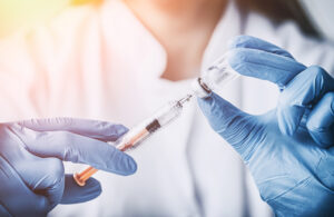 injecting injection vaccine vaccination medicine flu man doctor insulin health drug influenza concept - stock image