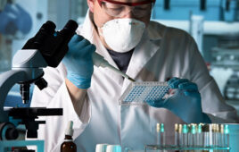 scientist working with microplate in a pharmaceutical lab / biomedical engineer working with samples in microplate in the laboratory