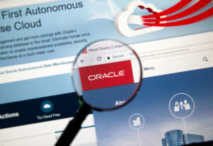 MONTREAL, CANADA - OCTOBER 2, 2017: Oracle home page under magnifying glass. Oracle is one of the largest vendors in the enterprise IT market.