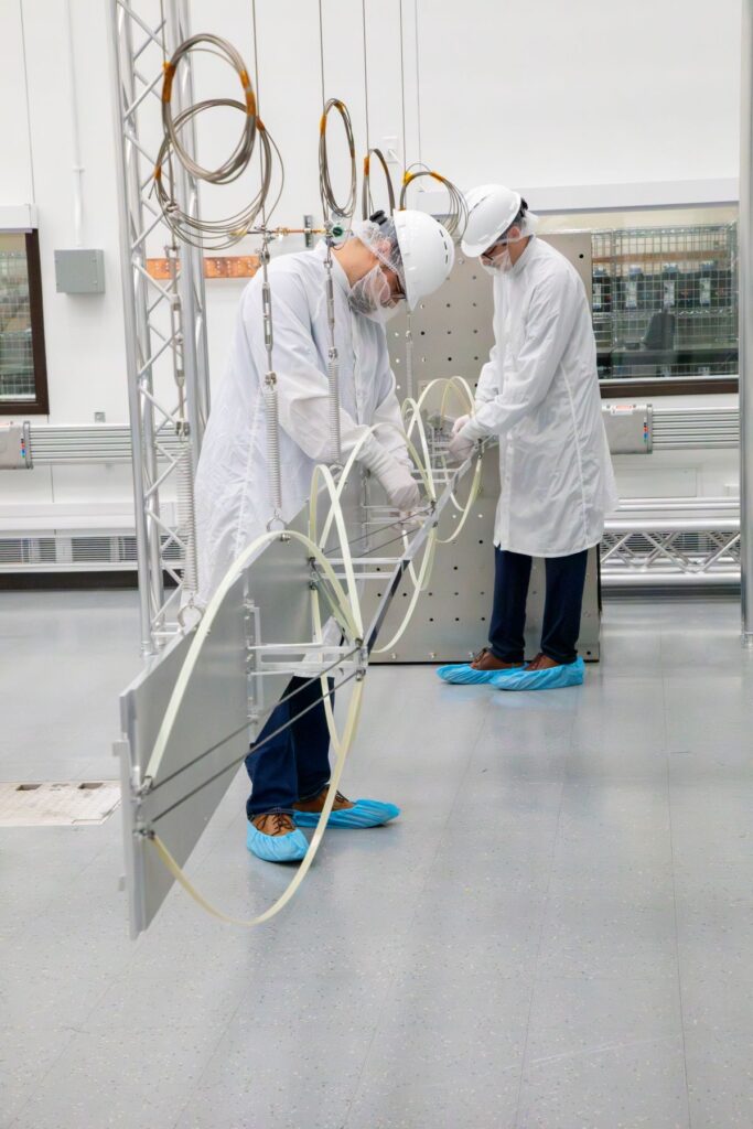 SwRI engineers work on the internally funded Parallelogram Synchronized Truss Assembly (PaSTA), a mechanism designed to stabilize solar arrays on spacecraft performing on-orbit servicing and refueling. Credit: Southwest Research Institute.