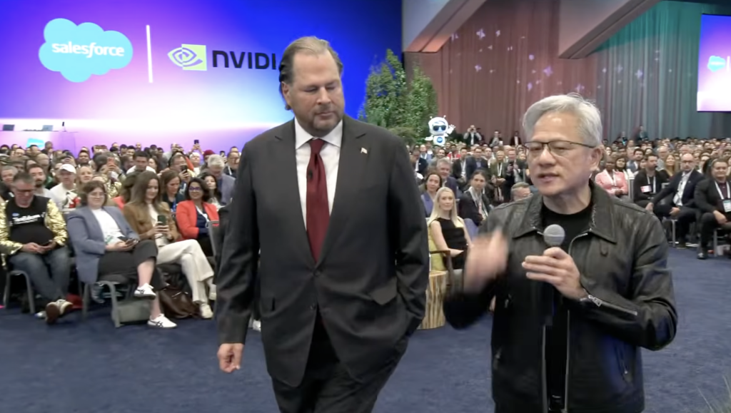 NVIDIA CEO Jensen Huang speaks alongside Marc Benioff in front of Salesforce and NVIDIA logos