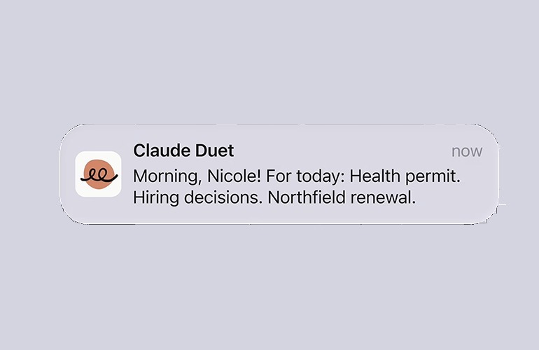 Claude Duet phone notification reading: Morning, Nicole! For today: Health permit. Hiring decisions. Northfield renewal.